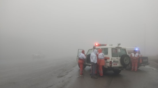 In this photo provided by MojNews on May 19, 2024, rescuers gather before heading towards the site of the "accident" involving a helicopter in the convoy of Iran's President in the Jolfa region of the western province of East Azerbaijan.&nbsp;(AFP)