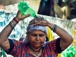 A woman pours water on her head to cool herself amid the ongoing heatwave, at the Swami Vivekananda Camp Chanakyapuri in New Delhi. (ANI) A woman pours water on her head to cool herself amid the ongoing heatwave, at the Swami Vivekananda Camp Chanakyapuri in New Delhi. (ANI)
