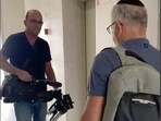 In this image from video, Israeli officials seize AP video equipment from an apartment block in Sderot, Southern Israel. (AP)