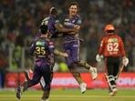 Kolkata Knight Riders' Mitchell Starc celebrates with teammates after the dismissal of Sunrisers Hyderabad's Travis Head.