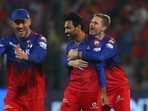 Royal Challengers Bengaluru's Swapnil Singh, centre, celebrates with teammates