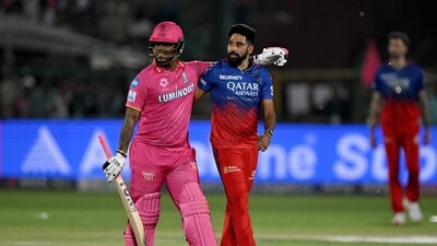 Rajasthan Royals' Shimron Hetmyer (L) and Royal Challengers Bengaluru's Mohammed Siraj (C) look on at the end of the Indian Premier League (IPL) Twenty20 cricket match between Rajasthan Royals and Royal Challengers Bengaluru (AFP) Rajasthan Royals' Shimron Hetmyer (L) and Royal Challengers Bengaluru's Mohammed Siraj (C) look on at the end of the Indian Premier League (IPL) Twenty20 cricket match between Rajasthan Royals and Royal Challengers Bengaluru (AFP)