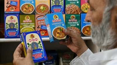 A man buys packets of MDH spices at a store in Amritsar. (AFP) A man buys packets of MDH spices at a store in Amritsar. (AFP)