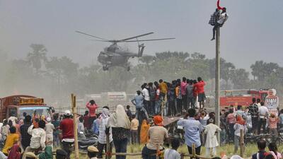 Prime Minister Narendra Modi's chopper leaves after an election meeting at Maharajganj in Siwan district on Tuesday. (PTI)