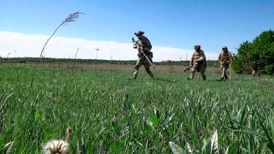 Russian army's snipers change their position facing Ukrainian troops at an undisclosed location. (Russian Defense Ministry Press Service via AP) (AP)