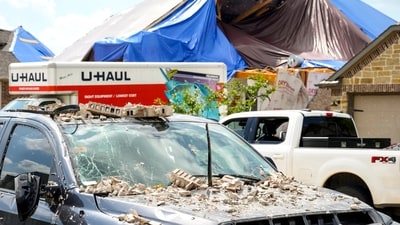 A truck is covered in debris as a families in Bridgeland begin to recover from and clean up storm damage on Sunday, May 19, 2024, in Cypress, Texas. The suburban Houston area of Bridgeland suffered major damage last week after a line of powerful storms, that included a confirmed tornado, swept through the area. (Brett Coomer/Houston Chronicle via AP) (AP) A truck is covered in debris as a families in Bridgeland begin to recover from and clean up storm damage on Sunday, May 19, 2024, in Cypress, Texas. The suburban Houston area of Bridgeland suffered major damage last week after a line of powerful storms, that included a confirmed tornado, swept through the area. (Brett Coomer/Houston Chronicle via AP) (AP)
