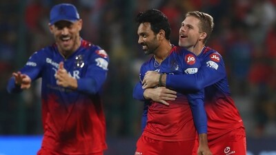Royal Challengers Bengaluru's Swapnil Singh, centre, celebrates with teammates (AP) Royal Challengers Bengaluru's Swapnil Singh, centre, celebrates with teammates (AP)
