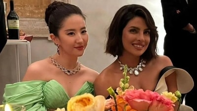 In the photos and videos, Priyanka Chopra can be seen making a fashion statement in an off-shoulder cream and black dress. To elevate her ensemble, she wore a Serpenti Aeterna necklace. Besides her outfit and jewellery, her new hairdo created an impression among her fans as well. In the photos and videos, Priyanka Chopra can be seen making a fashion statement in an off-shoulder cream and black dress. To elevate her ensemble, she wore a Serpenti Aeterna necklace. Besides her outfit and jewellery, her new hairdo created an impression among her fans as well. 