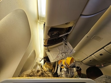 The interior of Singapore Airline flight SQ321 shows the oxygen masks having dropped as the flight faced extreme turbulence. (Reuters)