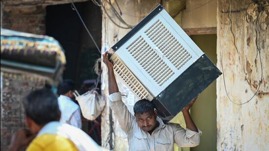 Amid rising mercury levels, people flocked to Kamla Market to purchase air coolers and conditioners. (Sanchit Khanna/HT Photo)