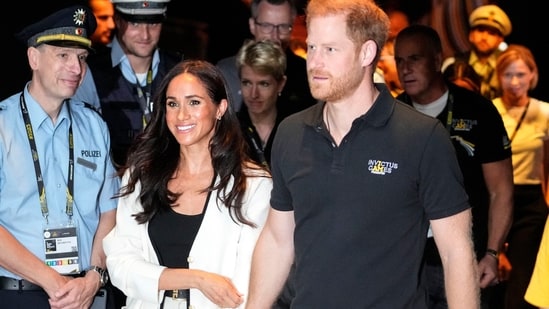 FILE - Britain's Prince Harry, right, and Meghan, Duchess of Sussex, arrive to a wheelchair basketball match at the Invictus Games in Duesseldorf, Germany, Sept. 13, 2023. Prince Harry and his wife, Meghan, will visit Nigeria in May 2024 for talks on the Invictus Games, which he founded to aid the rehabilitation of wounded and sick servicemembers and veterans, a Nigerian official said Sunday, April 28, 2024. (AP Photo/Martin Meissner, File) (AP)