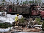 A firefighter walks among homes destroyed by a tornado Tuesday, May 21, 2024, in Greenfield, Iowa. AP/PTI(AP05_22_2024_000022B)