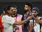 Bollywood actor and co-owner of Kolkata Knight Riders' team Shah Rukh Khan (L) speaks with captain Shreyas Iyer (2R) 