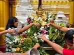 Towering above them was the main, gold-plated spire of the Shwedagon Pagoda, which rises 99 meters (325 feet) into the sky and is believed to house four relics of the Buddha.(AFP)