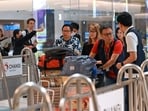 Passengers of Singapore Airlines flight SQ321 from London to Singapore, which made an emergency landing in Bangkok, are escorted by ground staff upon arrival at Changi Airport in Singapore. (AFP) Passengers of Singapore Airlines flight SQ321 from London to Singapore, which made an emergency landing in Bangkok, are escorted by ground staff upon arrival at Changi Airport in Singapore. (AFP)