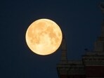 The full moon, also known as the Supermoon or Flower Moon, is seen behind the Lomonosov Moscow State University in Moscow, Russia May 8, 2020. REUTERS/Shamil Zhumatov The full moon, also known as the Supermoon or Flower Moon, is seen behind the Lomonosov Moscow State University in Moscow, Russia May 8, 2020. REUTERS/Shamil Zhumatov