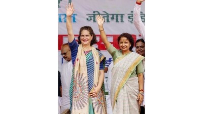 Congress General Secretary Priyanka Gandhi Vadra with JMM leader Kalpana Soren at a public meeting in Godda, Jharkhand. (PTI) Congress General Secretary Priyanka Gandhi Vadra with JMM leader Kalpana Soren at a public meeting in Godda, Jharkhand. (PTI)