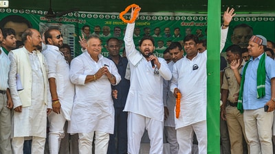 RJD leader Tejashwi Yadav with party candidate Vijay Kumar Shukla during an election rally in Muzaffarpur, Bihar. (PTI) RJD leader Tejashwi Yadav with party candidate Vijay Kumar Shukla during an election rally in Muzaffarpur, Bihar. (PTI)