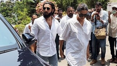 Deepika Padukone held Ranveer Singh's hand and gently cradled her baby bump as she smiled for the cameras on Monday while stepping out to cast her vote in phase 5 of Lok Sabha elections 2024. Deepika and Ranveer sported matching outfits – white shirt and blue jeans. (ANI) Deepika Padukone held Ranveer Singh's hand and gently cradled her baby bump as she smiled for the cameras on Monday while stepping out to cast her vote in phase 5 of Lok Sabha elections 2024. Deepika and Ranveer sported matching outfits – white shirt and blue jeans. (ANI)
