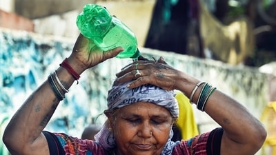 Heatwave: A woman pours water on her head to cool herself amid the ongoing heatwave, at the Swami Vivekananda Camp Chanakyapuri in New Delhi on Tuesday. (ANI Photo/Mohd Zakir) (Mohd Zakir) Heatwave: A woman pours water on her head to cool herself amid the ongoing heatwave, at the Swami Vivekananda Camp Chanakyapuri in New Delhi on Tuesday. (ANI Photo/Mohd Zakir) (Mohd Zakir)