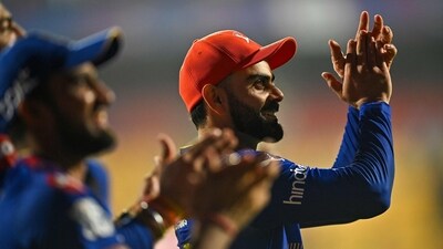 Royal Challengers Bengaluru's Virat Kohli (R) celebrates after winning the Indian Premier League (IPL) Twenty20 cricket match against Chennai Super Kings (AFP) Royal Challengers Bengaluru's Virat Kohli (R) celebrates after winning the Indian Premier League (IPL) Twenty20 cricket match against Chennai Super Kings (AFP)