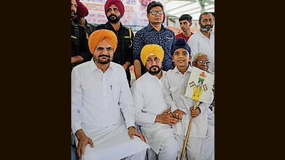 Congress candidate and former CM Charanjit Singh Channi along with Balkour Singh, father of slain Punjabi singer Sidhu Moose Wala, addressed poll rallies in Jalandhar’s Shahkot on Wednesday. (HT Photo)
