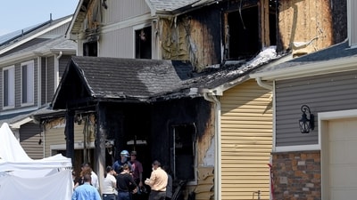 FILE - Investigators stand outside a house where five immigrants from Senegal were found dead after a fire in suburban Denver on Aug. 5, 2020. Kevin Bui pleaded guilty Friday, May 17, 2024, to a house fire that killed five members of the Senegalese family in 2020 in a case of misplaced revenge caused by mistakenly tracking his stolen iPhone to the home. (AP Photo/Thomas Peipert, File) (AP) FILE - Investigators stand outside a house where five immigrants from Senegal were found dead after a fire in suburban Denver on Aug. 5, 2020. Kevin Bui pleaded guilty Friday, May 17, 2024, to a house fire that killed five members of the Senegalese family in 2020 in a case of misplaced revenge caused by mistakenly tracking his stolen iPhone to the home. (AP Photo/Thomas Peipert, File) (AP)