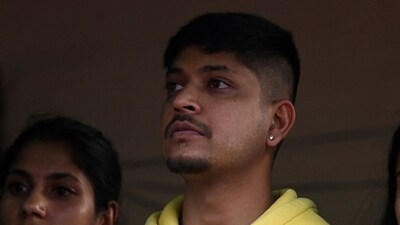 Sandeep Lamichhane looks on outside Patan High Court in Lalitpur district of Kathmandu on May 15, 2024, after his acquittal by the court in a rape case. (AFP) Sandeep Lamichhane looks on outside Patan High Court in Lalitpur district of Kathmandu on May 15, 2024, after his acquittal by the court in a rape case. (AFP)