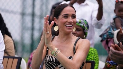 Meghan Markle watches her husband Prince Harry play in an exhibition sitting volleyball match, in Abuja, Nigeria, Saturday, May 11, 2024. Prince Harry and his wife Meghan are in Nigeria to champion the Invictus Games, which he founded to aid the rehabilitation of wounded and sick servicemembers and veterans. (AP Photo/Sunday Alamba) (AP) Meghan Markle watches her husband Prince Harry play in an exhibition sitting volleyball match, in Abuja, Nigeria, Saturday, May 11, 2024. Prince Harry and his wife Meghan are in Nigeria to champion the Invictus Games, which he founded to aid the rehabilitation of wounded and sick servicemembers and veterans. (AP Photo/Sunday Alamba) (AP)