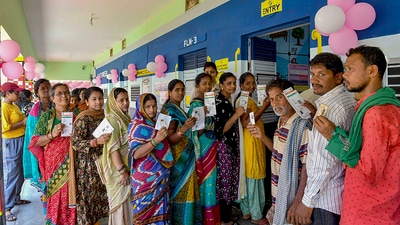 **EDS: IMAGE VIA PIB** Berhampur: Voters display identity cards while standing in queue to cast their votes during the 4th phase of general elections, in Berhampur, Odisha, Monday, May 13, 2024. (PTI Photo) (PTI05_13_2024_000312B) (PTI) **EDS: IMAGE VIA PIB** Berhampur: Voters display identity cards while standing in queue to cast their votes during the 4th phase of general elections, in Berhampur, Odisha, Monday, May 13, 2024. (PTI Photo) (PTI05_13_2024_000312B) (PTI)
