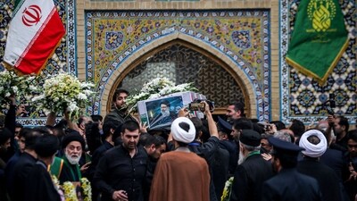 From Tabriz, Ebrahim Raisi's body was taken to the Shiite clerical centre of Qom later Tuesday before being moved to Tehran,&nbsp;where&nbsp;huge&nbsp;banners hailing him as "the martyr of service" have appeared around the city. (AFP)