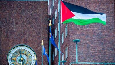 The Palestinian flag was raised in the courtyard outside Oslo City Hall on Wednesday morning in Oslo, Norway, (Reuters Photo)