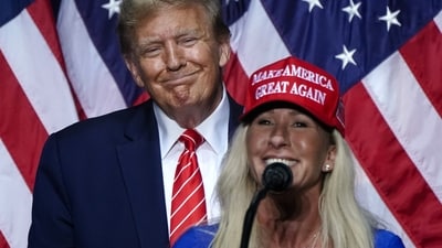 US Representative Marjorie Taylor Greene (R) speaks alongside former US President and 2024 presidential hopeful Donald Trump at a campaign event in Rome, Georgia, on March 9, 2024. (Photo by Elijah Nouvelage / AFP) (AFP) US Representative Marjorie Taylor Greene (R) speaks alongside former US President and 2024 presidential hopeful Donald Trump at a campaign event in Rome, Georgia, on March 9, 2024. (Photo by Elijah Nouvelage / AFP) (AFP)
