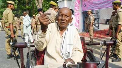 An elderly voter shows his ink-marked finger after casting his ballot in Etawah, Uttar Pradesh. (ANI Photo) An elderly voter shows his ink-marked finger after casting his ballot in Etawah, Uttar Pradesh. (ANI Photo)
