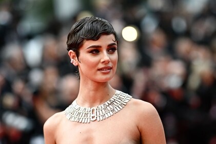 US model Taylor Hill arrives for the Opening Ceremony and the screening of the film "Le Deuxieme Acte" at the 77th edition of the Cannes Film Festival in Cannes. (Photo by LOIC VENANCE / AFP)