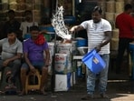 A man sprinkles water in front of his shop during a hot summer day in the old quarters of New Delhi. (AFP) A man sprinkles water in front of his shop during a hot summer day in the old quarters of New Delhi. (AFP)