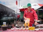 Juventino Alanis of the Sociedad Mexicano de Parrillieros team prepares food for tasting at the World Championship Barbecue Cooking Contest, 