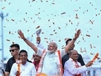 Prime Minister Narendra Modi during a road show in Puri on Monday. (ANI)