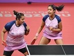India's Sutirtha Mukherjee (L) and Ayhika Mukherjee (R) celebrate a point as they compete against China's Chen Meng and Wang Yidi in the women's doubles quarter-final table tennis match
