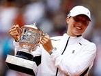 Poland's Iga Swiatek poses with her Suzanne Lenglen trophy after winning her final match against Czech Republic's Karolina Muchova 