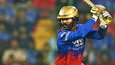 Dinesh Karthik plays a shot during the IPL Twenty20 cricket match between Royal Challengers Bengaluru and Gujarat Titans (AFP) Dinesh Karthik plays a shot during the IPL Twenty20 cricket match between Royal Challengers Bengaluru and Gujarat Titans (AFP)