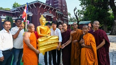Monks and devotees carry an idol of Lord Buddha on the occasion of the Buddha Purnima festival in Tripura's Agartala. (PTI)