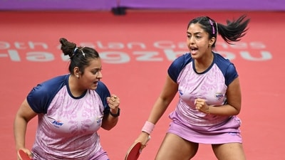 India's Sutirtha Mukherjee (L) and Ayhika Mukherjee (R) celebrate a point as they compete against China's Chen Meng and Wang Yidi in the women's doubles quarter-final table tennis match (AFP) India's Sutirtha Mukherjee (L) and Ayhika Mukherjee (R) celebrate a point as they compete against China's Chen Meng and Wang Yidi in the women's doubles quarter-final table tennis match (AFP)