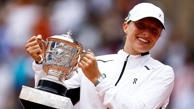Poland's Iga Swiatek poses with her Suzanne Lenglen trophy after winning her final match against Czech Republic's Karolina Muchova (REUTERS)