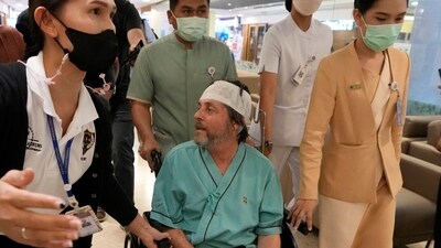 An Australian passenger who was injured on the flight talks to reporters at Samitivej Srinakarin Hospital in Bangkok. (AP) An Australian passenger who was injured on the flight talks to reporters at Samitivej Srinakarin Hospital in Bangkok. (AP)