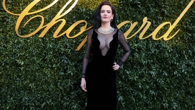 Eva Green serves up royalty as she dresses up in a gorgeous Versace gown. Her elegant outfit features sheer fabric at the neck and full sleeves. The bodycon fit accentuates her curves with a floor-sweeping hemline. Styled with a luxurious multi-layered pearl necklace and matching earrings, she oozes red carpet glamour. (Photo by Vianney Le Caer/Invision/AP) Eva Green serves up royalty as she dresses up in a gorgeous Versace gown. Her elegant outfit features sheer fabric at the neck and full sleeves. The bodycon fit accentuates her curves with a floor-sweeping hemline. Styled with a luxurious multi-layered pearl necklace and matching earrings, she oozes red carpet glamour. (Photo by Vianney Le Caer/Invision/AP)