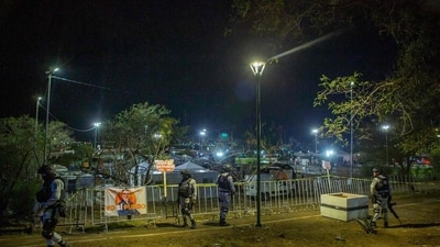 Video of the accident showed the structure suddenly falling forward into the crowd, sending politicians on the stage and panicked attendees running for cover. (AFP) Video of the accident showed the structure suddenly falling forward into the crowd, sending politicians on the stage and panicked attendees running for cover. (AFP)