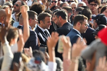 France's President Emmanuel Macron (Centre L) speaks with President of the Paris 2024 Olympics and Paralympics Organising Committee (Cojo) Tony Estanguet (centre R). (AFP) France's President Emmanuel Macron (Centre L) speaks with President of the Paris 2024 Olympics and Paralympics Organising Committee (Cojo) Tony Estanguet (centre R). (AFP)