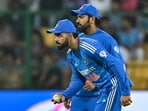 Rohit Sharma and his teammate Virat Kohli (L) look on during a match. Rohit Sharma and his teammate Virat Kohli (L) look on during a match.