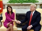 (FILES) US President Donald Trump shakes hands with Nikki Haley, the United States Ambassador to the United Nations  in the Oval office of the White House on October 9, 2018 in Washington, DC. Former presidential hopeful Nikki Haley said May 22, 2024 she will vote for Donald Trump in November's US election, ending months of silence after quitting the contest to choose a Republican to face Joe Biden. (Photo by Olivier Douliery / AFP)